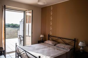 Postel nebo postele na pokoji v ubytování B&B Caravello