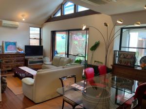 a living room with a couch and a table at Kasumi-an in Kumamoto
