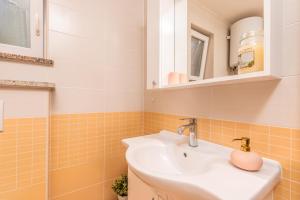 a bathroom with a sink and a shower at Apartment M&M Klimno in Klimno
