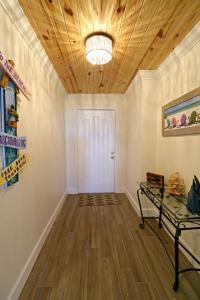 an empty room with a wooden ceiling at Barefoot Trace 109 in St. Augustine