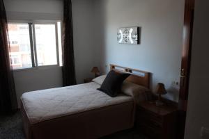 Cama o camas de una habitación en Apartamento Plaza Reina