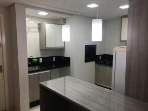 A kitchen or kitchenette at Apartamento Super Aconchegante