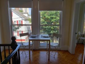 a table and chairs in a room with a window at shared house in Federal Hill in Providence