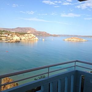 a view of the ocean from a balcony at Artemis Apartments in Almyrida