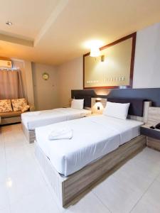 Cama o camas de una habitación en Atikarn Princess Hotel & Resort