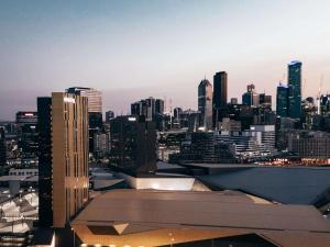 a view of a city skyline with buildings at Novotel Melbourne South Wharf in Melbourne