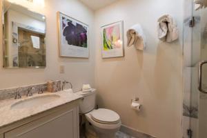 a bathroom with a toilet and a sink and a shower at Texas Townhome Minutes to Gondola in Vail +4 photos