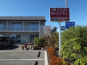 a sign for a motel in front of a building at 101 Stars Motel in Christchurch
