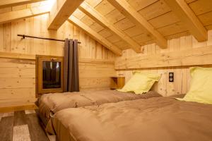 Lova arba lovos apgyvendinimo įstaigoje Chalet Horizon 180 4 étoiles Sauna