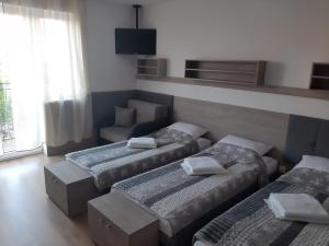 Postel nebo postele na pokoji v ubytování Tasarz Spa Ośrodek Wczasowy