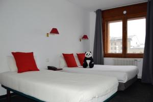 Ένα ή περισσότερα κρεβάτια σε δωμάτιο στο Hotel Panda
