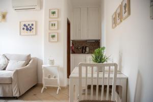 a living room with a couch and a chair at Scalinatella in Positano