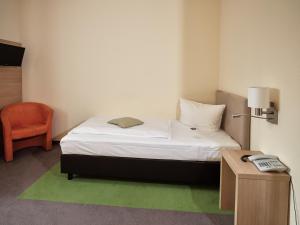 Postel nebo postele na pokoji v ubytování Hotel Gasthaus zur Linde