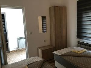 Posteľ alebo postele v izbe v ubytovaní Apartment & Room TOMA