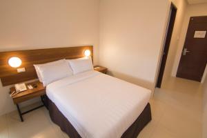 Mango Suites Cauayan客房内的一张或多张床位