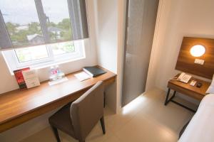 Mango Suites Cauayan客房内的一张或多张床位