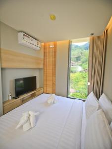 Posteľ alebo postele v izbe v ubytovaní Rocco Aonang Krabi