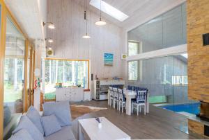 a living room with a couch and a table at Villa Hausma in Hiiumaa
