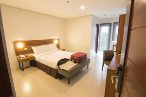 Mango Suites Cauayan客房内的一张或多张床位