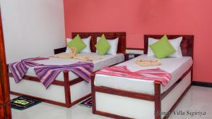 Letto o letti in una camera di Mango Villa Sigiriya