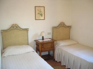 A bed or beds in a room at La Chiusetta