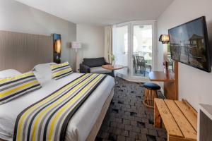 Thalazur Port-Camargue - Hotel & Spa客房内的一张或多张床位