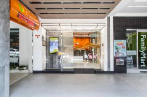 a store front with a glass door in a building at Cityinn Hotel Taipei Station Branch I in Taipei