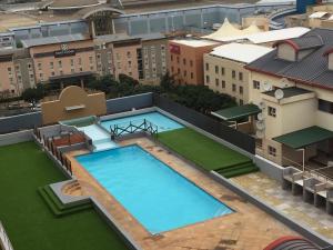 an overhead view of a large swimming pool on top of a building at AYA LUXURY APARTMENTS 78 in Durban