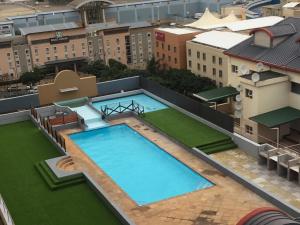 an overhead view of a large swimming pool on top of a building at AYA LUXURY APARTMENTS 79 in Durban
