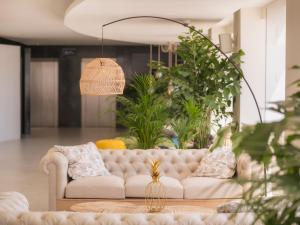 A seating area at Amàre Beach Hotel Ibiza - Adults Recommended
