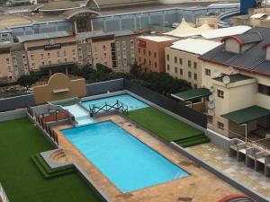 an overhead view of a large swimming pool on top of a building at AYA LUXURY APARTMENTS 99 in Durban