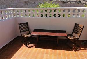 a table and two chairs sitting on a patio at Bungalow in Altamar complex in Arona