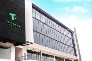 a building with a t sign on the side of it at T+ PREMIUM HOTEL in Alor Setar