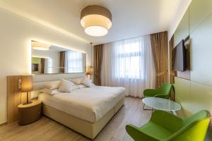Postel nebo postele na pokoji v ubytování Salvator Boutique Hotel vegan-friendly + 37 fotografií