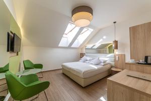 Posteľ alebo postele v izbe v ubytovaní Salvator Boutique Hotel vegan-friendly