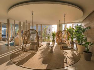 A seating area at Amàre Beach Hotel Ibiza - Adults Recommended