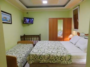 A bed or beds in a room at Apartments Klakor