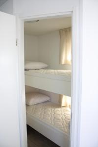 Ένα ή περισσότερα κρεβάτια σε δωμάτιο στο Chalet Charlee