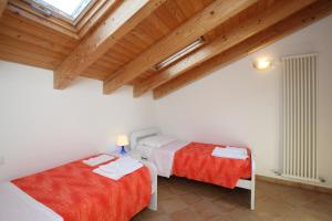 En eller flere senge i et værelse på La casa al mare