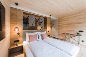 Katil atau katil-katil dalam bilik di Hotel Adler