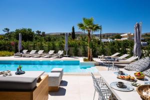 The swimming pool at or close to Vasilios Villa, with Pool, Gym & Close to Beach, By ThinkVilla