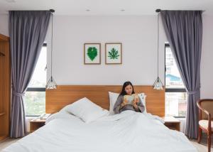 Postel nebo postele na pokoji v ubytování Phnom Penh 51 Hotel & Residences