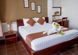 Giường trong phòng chung tại Ananas Family Hotel