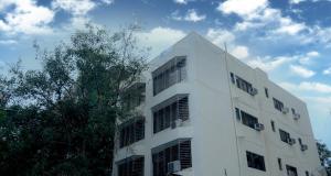 a white building with windows on the side of it at Lalsai Residency Andheri in Mumbai