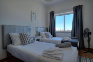 מיטה או מיטות בחדר ב-Sunny Monte Estoril