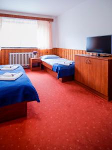 Letto o letti in una camera di Hacienda ČERT Kořenov