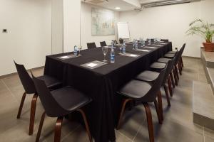a long table with chairs in a room at Hotel Arrizul Congress in San Sebastián