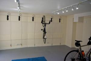 a room with a bicycle and lights on the wall at The Old Seed Store in Kelso