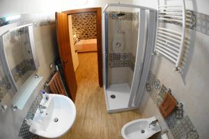 a bathroom with a shower and a sink at Etna Paradise locazioni brevi in Ragalna