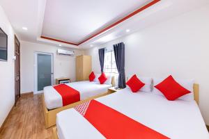 Postel nebo postele na pokoji v ubytování M&C Hotel Nha Trang